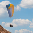 15-Minute Paragliding Flight Over Jebel Al Fayah Desert for One |  at Wondergifts