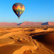 Dubai Hot Air Balloon - Magical Sunrise Desert Flight with Refreshment and Camel Ride