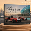 Promotional poster for track driving blast at Yas Marina Circuit with two red cars on a wooden stand.